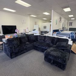 Large corduroy sectional with sleeper and storage