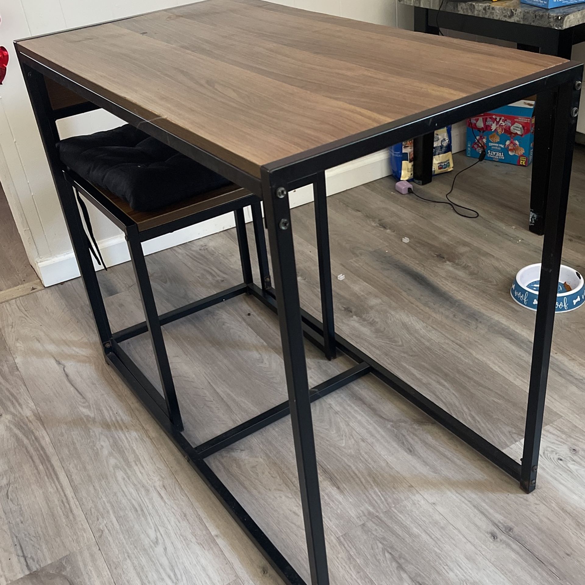 table and two chairs plus seat covers