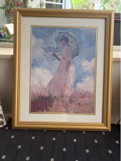 Monet lithograph women with a parasol  facing left