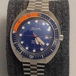 Bulova Oceanographer Devil Diver 96B321 automatic watch with a blue dial, orange and blue unidirectional bezel, and stainless steel bracelet. (013)