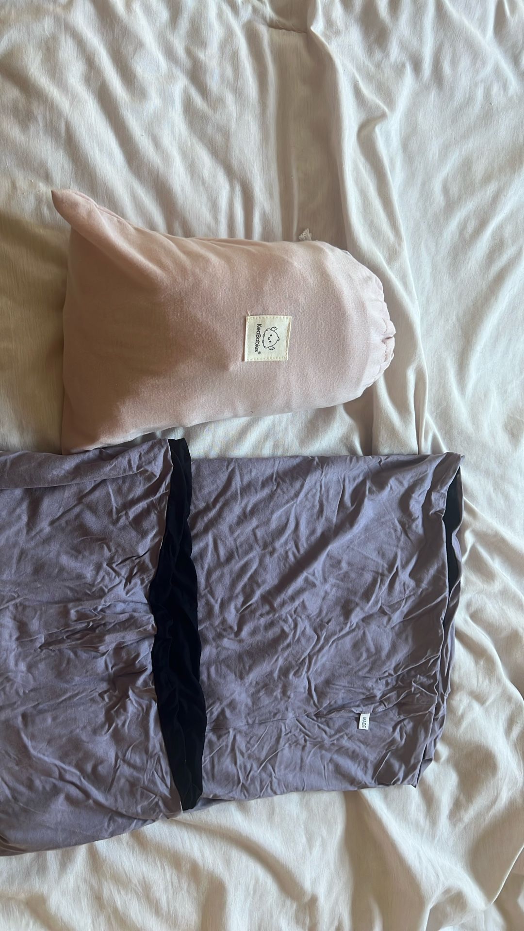 2 soft baby carriers