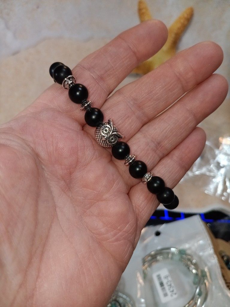 Black Beaded Stretch Bracelet With A Silver Colored Owl For A Charm