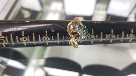 Diamond ring with emerald