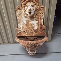 Antique cast-iron lions head fountain