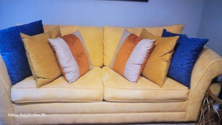 Yellow suede couch.  Sold as is