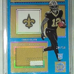 The product is a 2022 Raw Football trading card featuring a Chris Olave Sapphire Future Wave Raw Patch,  This standard-sized card is part of a set fro