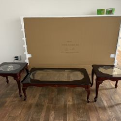 Antique coffee table and a patching pair of smaller tables
