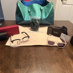 Louis Vuitton duffel bag ,Cartier glasses ,and Prada glasses