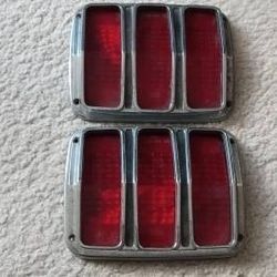 Mustang 1964 tail lights O.E.M fomoco

Original pair very good condition,bezels and lenses included -no cracks...lenses say "SAE-TSDB-64-CR"...check p