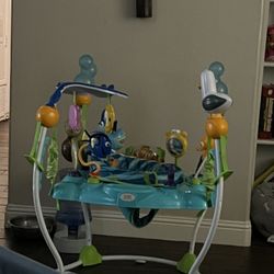 Bright Starts Disney Baby Finding Nemo Sea of Activities Baby Activity Center Jumper with Interactive Toys, Lights, Songs & Sounds, 6-12 Months (Blue)