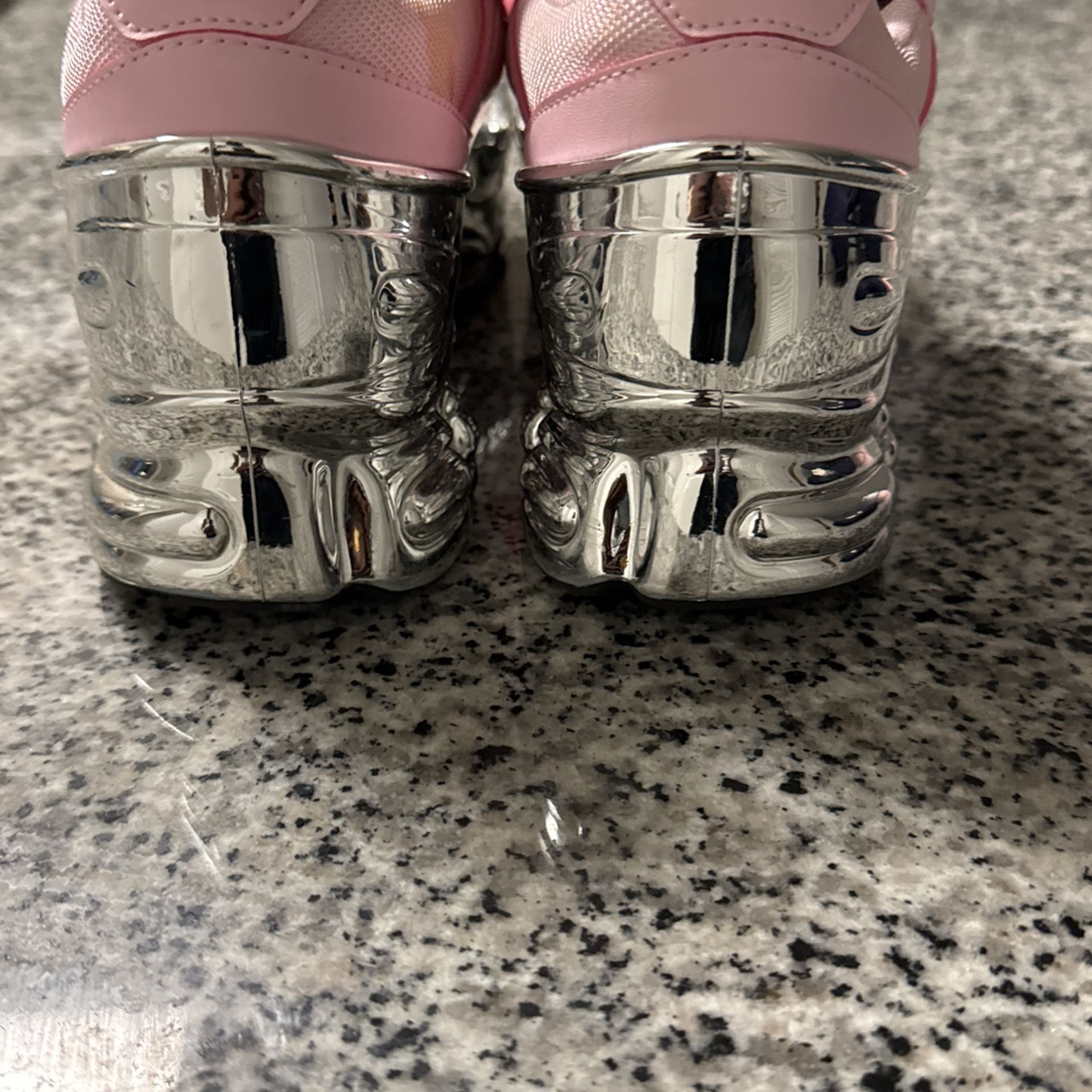 RAF Simmons X Ozweego Mirrored Clear Pink.