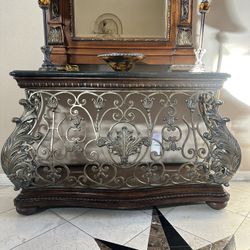 Stone and wrought iron cradenza with long mirror