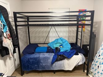 Twin loft bed, desk, stand, art work.