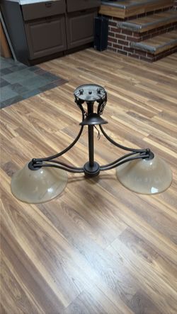 3-light chandelier with glass bowls in the shape of a bell stained with tea and rolls and square arms, forged bronze