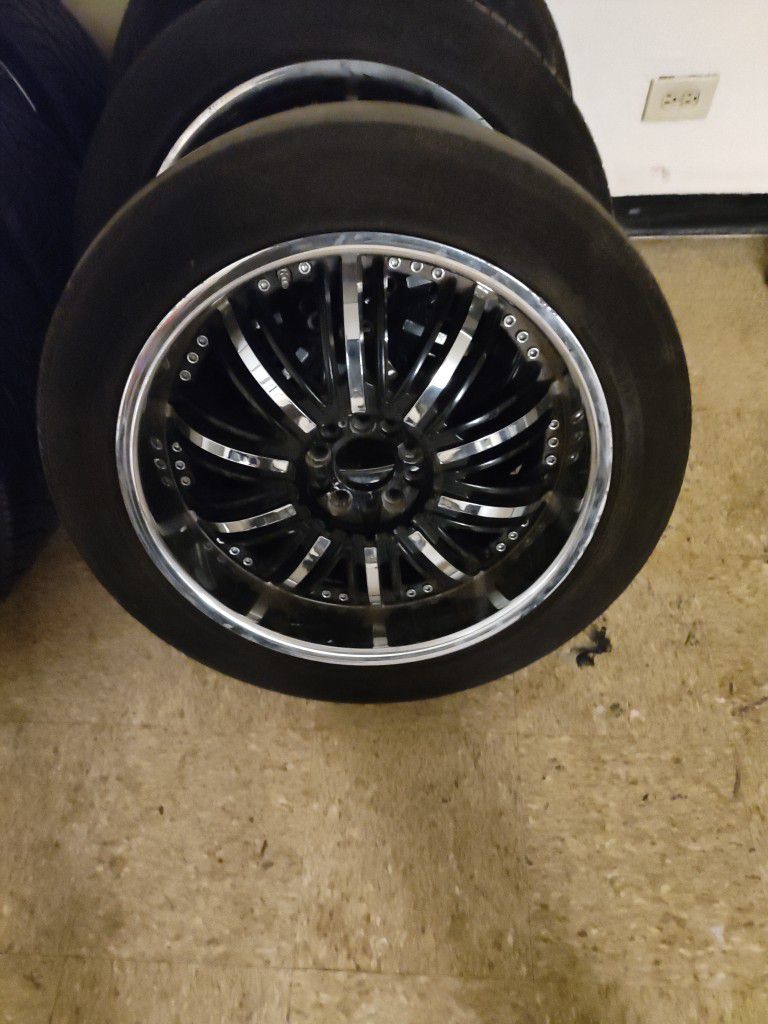 20 In Black And Chrome Rims With Center Caps