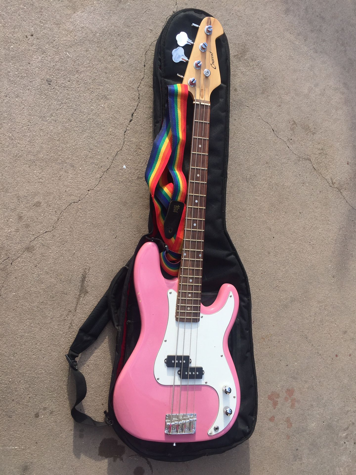 Pink P bass style electric bass guitar with gig bag