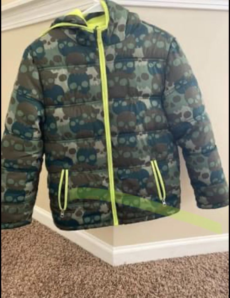 12-14 boys coat lined with fleece, has a hood and two side posters that open and close.  Smoke free home  $25