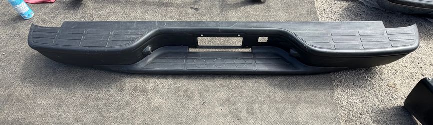 AS IS 99-06 CHEVY SILVERADO / GMC SIERRA BLACK REAR BUMPER MISSING BRACKETS AND HARDWARE