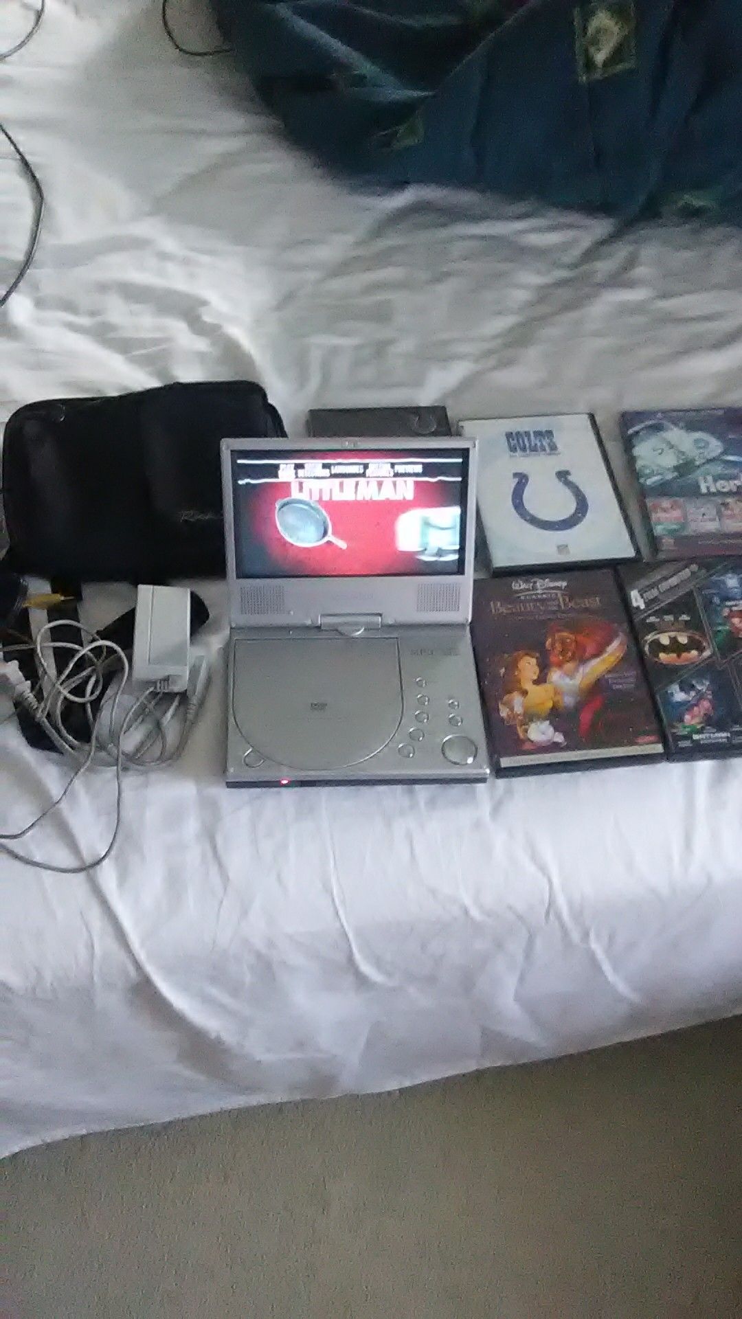 180 swivel portable DVD player and movies. Check my other offers out!