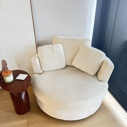 $300 Beige Swivel Chair 