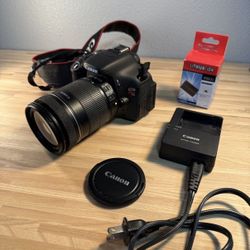 Canon EOS Rebel T3i SLR Camera with Canon Zoom lens 18-135 mm and brand new batteries