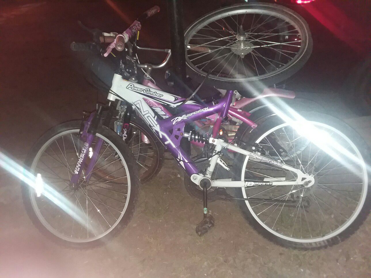 Purple and white women bike with shocks