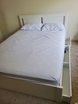 Queen-size white bed frame with storage drawers