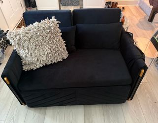 Stylish black Sleeper sofa with gold accents