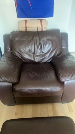 Brown “leather” chair with ottoman