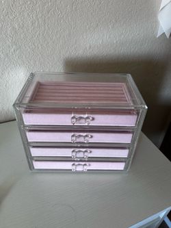 Clear acrylic jewelry box with pink velvet interior