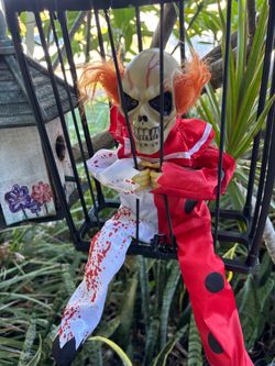 Animated Halloween skeletons in cages