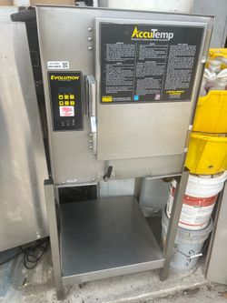 2018 AccuTemp Evolution Boiler-Free Commercial Steamer on stainless stand.  208V Single Phase unit.  Powered on successfully. Unit displayed low water