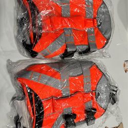 Two dog life vests