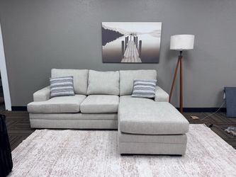Brand new beige reversible chaise sectional sofa
