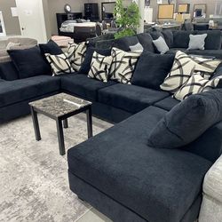 111 black sectional with colorful pillow $1,449