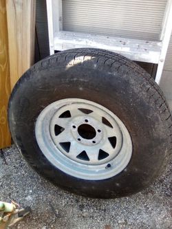 One 215/75/14"  Good Tire N Galvanized Rim $60 