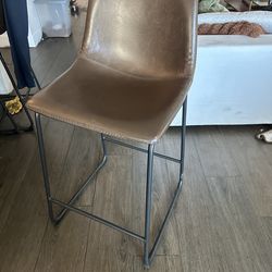 4 counter height brown leather chairs