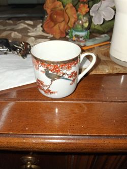 Vintage Porcelain Tea Cup with Bird Design