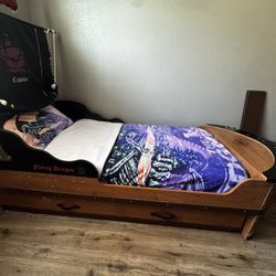 twin pirate beds and 1 twin mattress (250 each) mattress is  clean (25 bucks)
