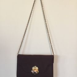 Smart and elegant brown evening purse gold shoulder strap the clasp is a tiny purse with sparkly rhinestones