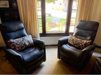 Two dark gray leather recliners