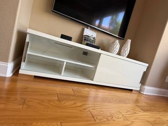 Long low white TV stand. Dimensions are in photos