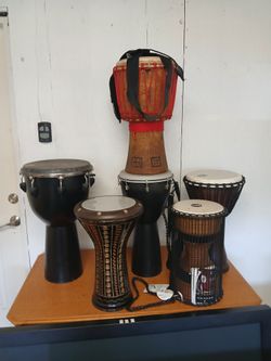 Yamaha drum set with sticks and stool blue in color African jimbee drums six total