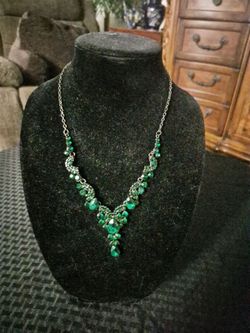 Green rhinestone and gunmetal necklace.