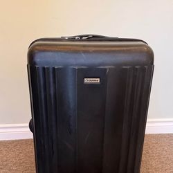 Black Diplomat 23-inch hardshell rolling suitcase in excellent condition.
