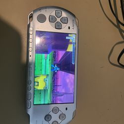 PSP slim w one game  and charger