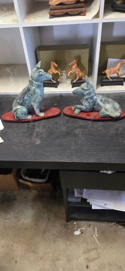 Antique estate sales Jade dog sculptures.