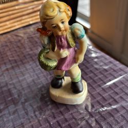 Girl Carrying A Basket