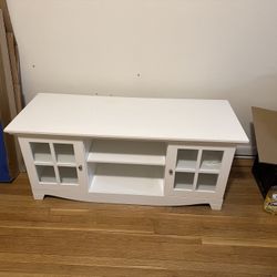 White TV unit with glass doors