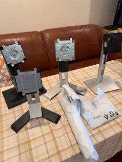 Computer monitor stands for Dell and ASUS